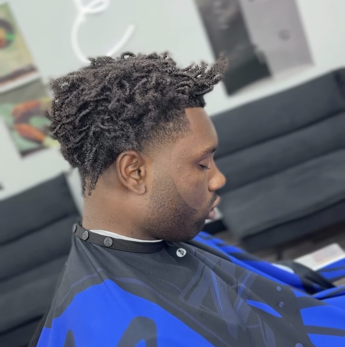 Textured crop with defined curls and clean taper